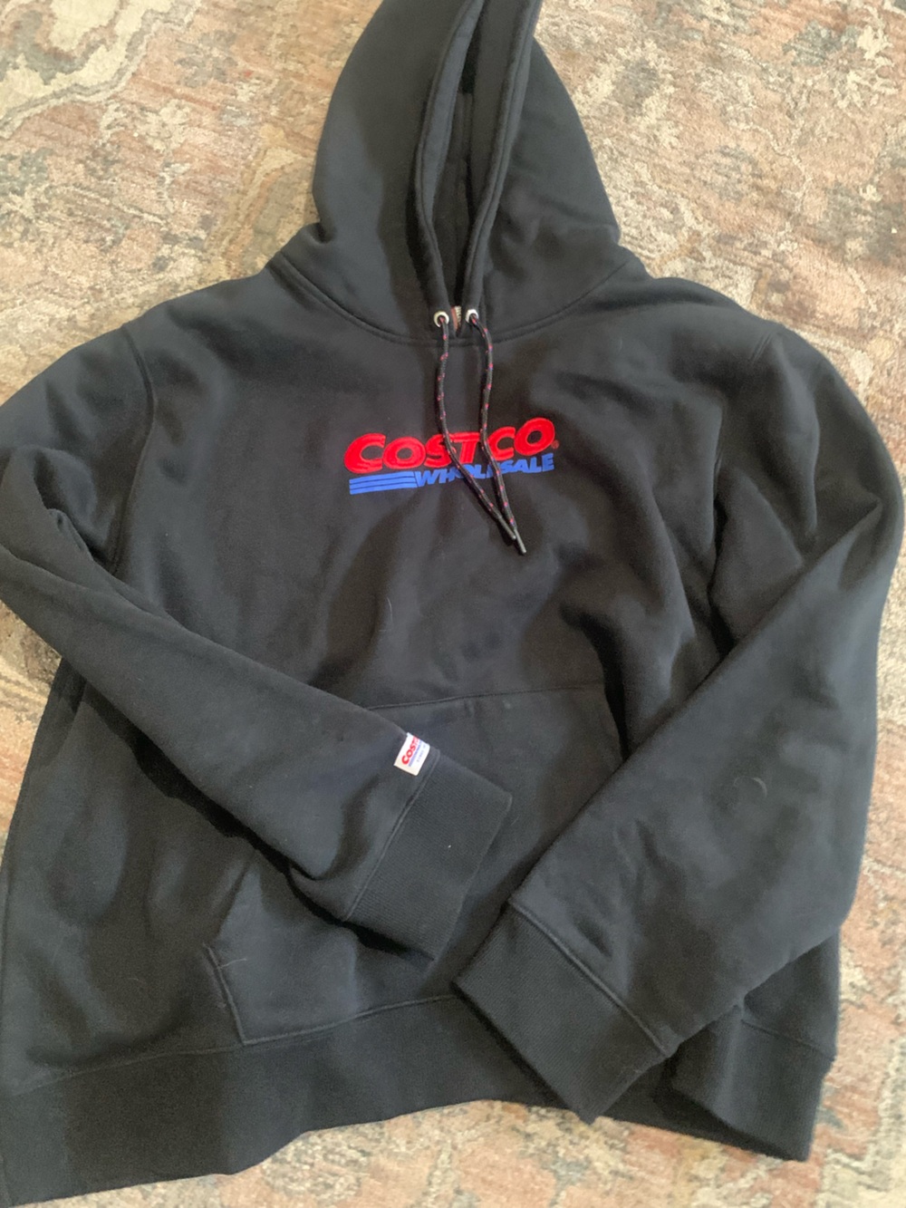 Kirkland Signature Black Hoodie with Red and Blue Logo